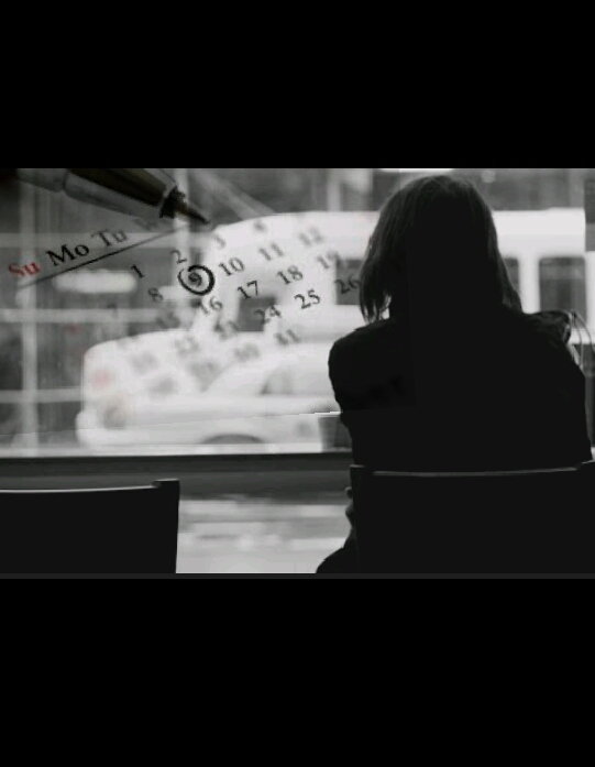 Girl in a coffee shop looking outside with the shadow of a calender beside her